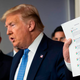 President Donald Trump holds up a printout of tweets from Google. The tweets say that Google is working with the U.S. to develop a national website that includes information about covid-19 symptoms, risk and testing information.